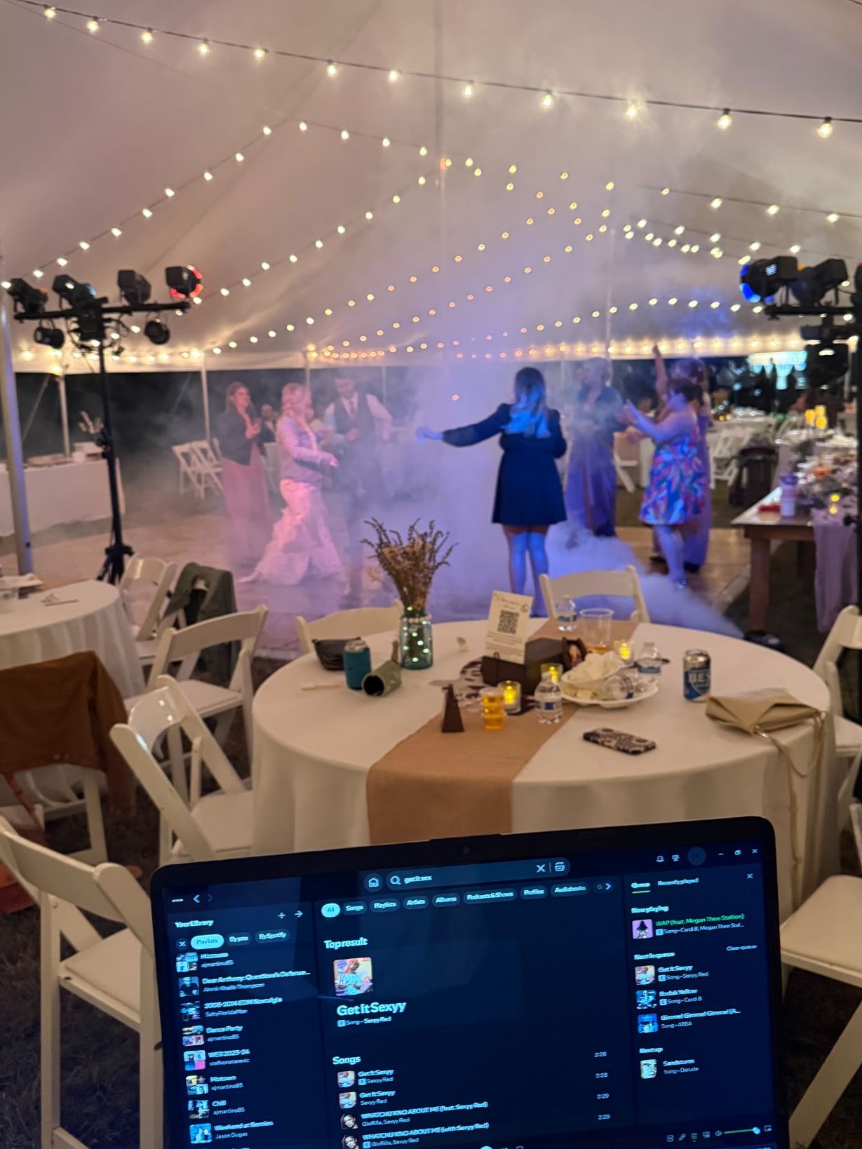DJ AJ’s music and colorful lights at a wedding reception